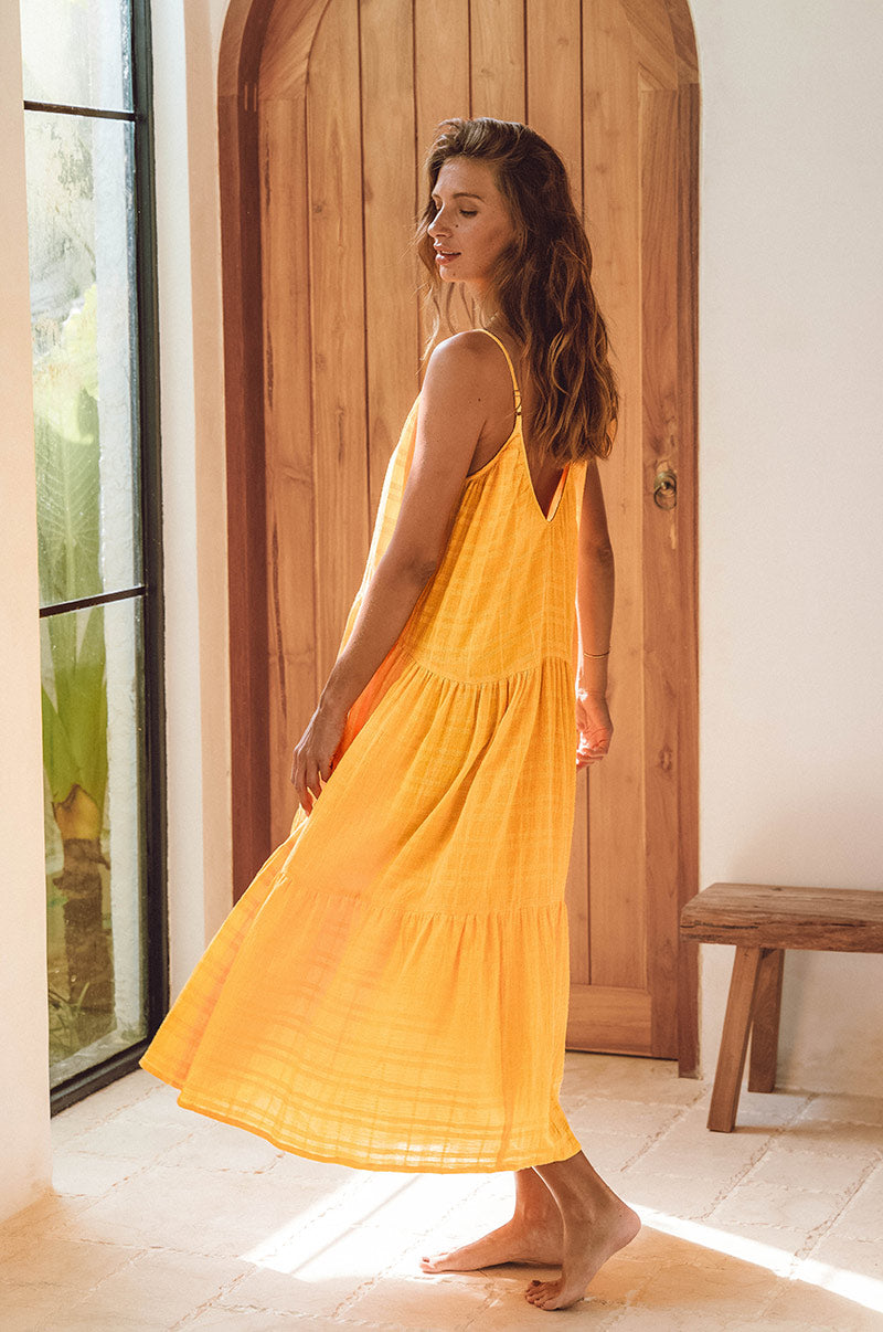 Loose-fit yellow beach dress with low scoop neckline